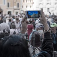 woman-taking-mobile-photo-of-european-architecture-2026-09-22-22-02-54-utc